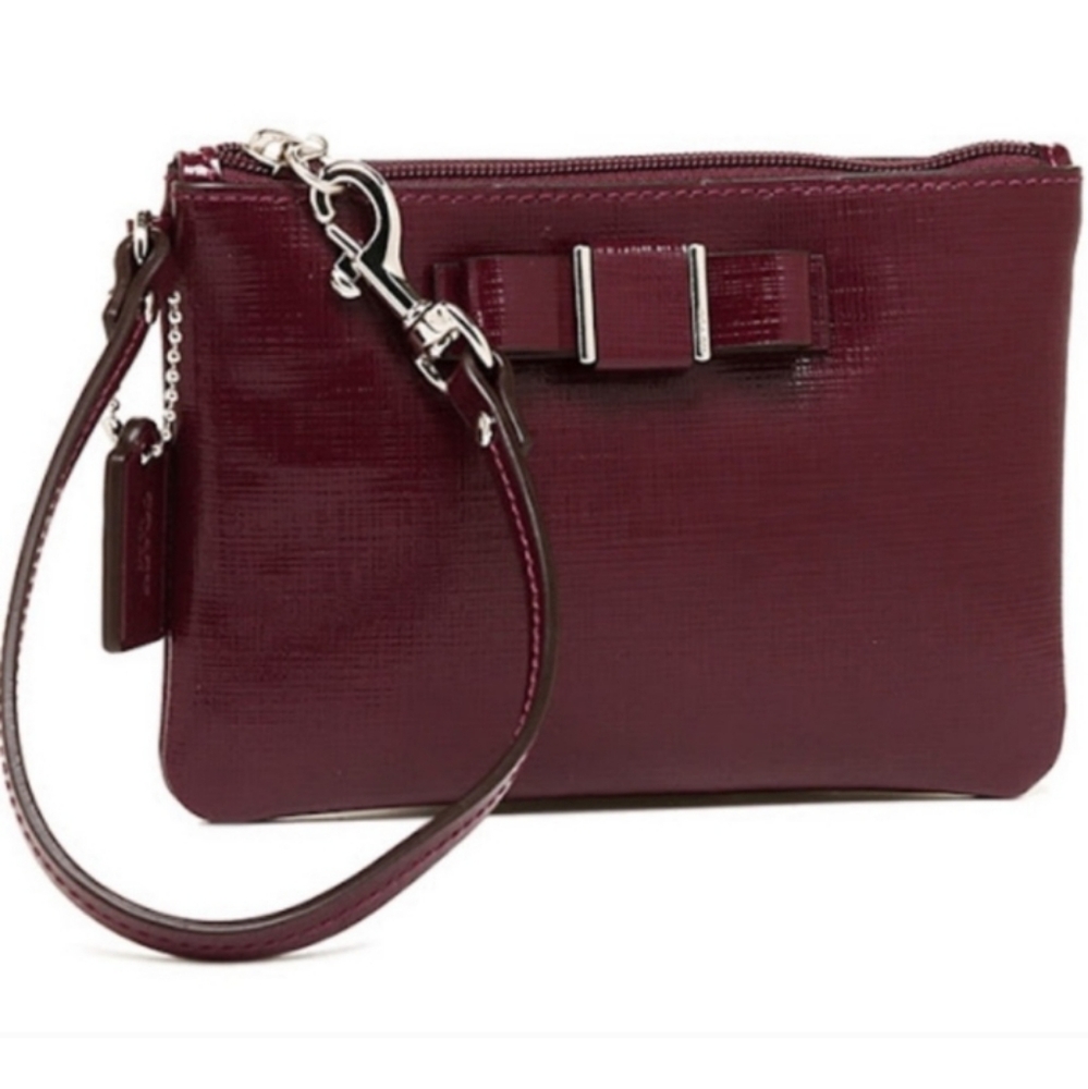 Coach Darcy Textured Saffiano Patent Leather Wristlet with bow detail in Sherry
